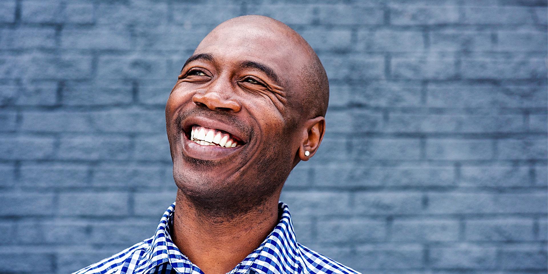 healthy man smiling with good oral and physical health